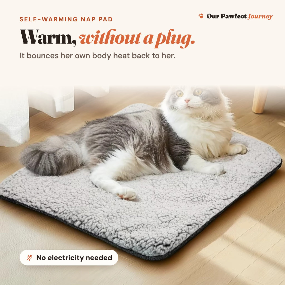 The self-warming nap pad with a cat lying on it: warm, without a plug